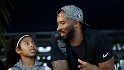 Bryant and Gianna watch the US national championships swimming meet in Irvine, California. AP