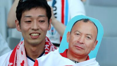 A fan waits for the Pool C game between England and Argentina in Tokyo. Associated Press