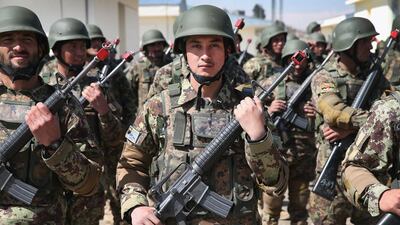 Soldiers with the Afghan National Army (ANA) graduate from basic training during a ceremony at the ANA’s combined fielding centre in Kabul. Scott Olson / Getty / March 18, 2014