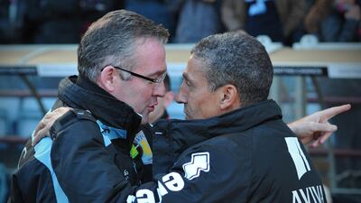 Norwich City's manager Chris Hughton greets his predecessor Paul Lambert - now Villa boss. Carl Court/AFP
