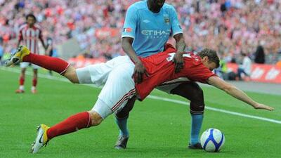 Manchester City's Yaya Toure vies for the ball against Stoke's Robert Huth during the FA Cup final.