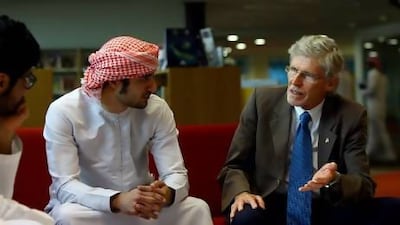 Dr Howard Reed talks to the students at the Dubai Men's College. Satish Kumar/The National