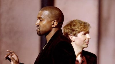 Winner for Album Of The Year Beck reacts as Kanye West appears on stage at the 57th Annual Grammy Awards in Los Angeles February 8, 2015. Robyn Beck / AFP photo