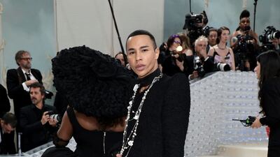 Designer Olivier Rousteing carries a 'Karl who?' bag. AFP