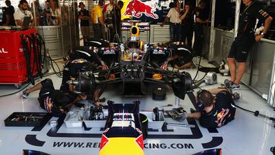 Mechanics work on Sebastian Vettel's car during final practice. Mark Thompson/Getty Image