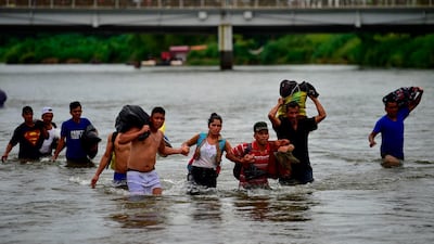 Groups try and make their way across the water. AFP