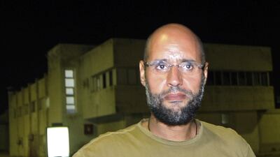 Seif Al Islam and eight other defendants were sentenced to death on Tuesday for crimes during the 2011 uprising. Imed Lamloum / AFP Photo