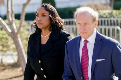 Fed governor Lisa Cook and her lawyer Abbe Lowell outside the Supreme Court in Washington. Bloomberg