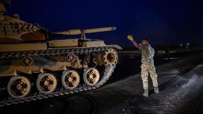 A Turkish army tank drives towards the border with Syria near Akcakale in Sanliurfa province. AFP