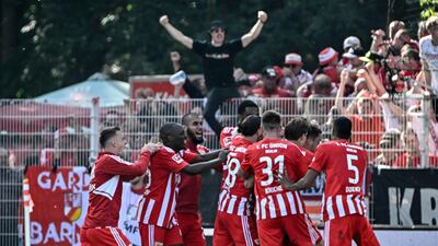 Union Berlin players celebrate after socring. AFP