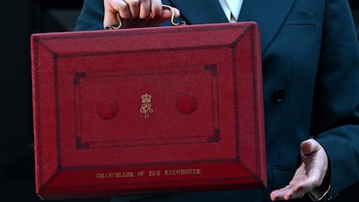 Chancellor Rachel Reeves holds up the red Budget Box as she sets off to present the UK government's annual Budget to Parliament. AFP