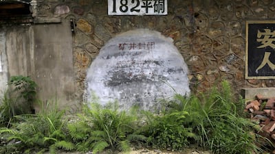 A sealed mine entrance is seen at a closed realgar mining plant at Heshan village. Jason Lee / Reuters