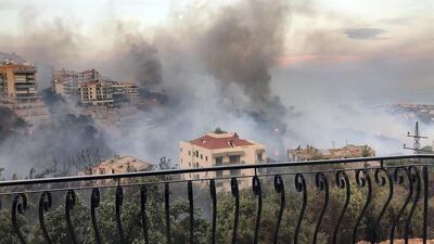 A view of the wildfire from a balcony. Image Lebanon Civil Defence via Twitter