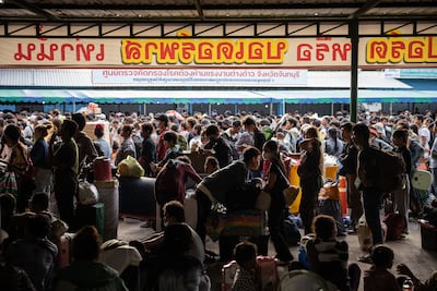 Cambodian migrant workers wait to cross the Ban Laem border checkpoint in large numbers in Chanthaburi, Thailand on Tuesday. Getty