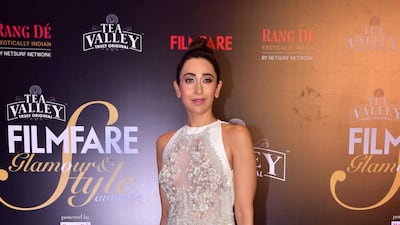 Karisma Kapoor's dress is just bridal enough: the floral applique by Lebanese-Italian designer Tony Ward is so beautifully done. Getty