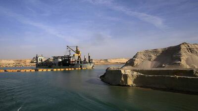 A dredger works on a section of the New Suez Canal during a media tour in Ismailia, Egypt. Hassan Ammar / AP Photo