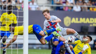 Barcelona's Frenkie de Jong challenges the Cadiz defence. AP