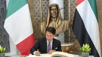 Giuseppe Conte, Prime Minister of Italy, signs a guest book during a reception at the Presidential Palace on November 15, 2018. Rashed Al Mansoori / Ministry of Presidential Affairs