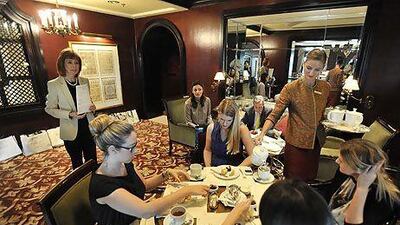 Alexandra Messervy of The English Manner, left, speaking at a session on etiquette and protocol at the Ritz-Carlton Hotel at the Marina in Dubai. Charles Crowell for The National