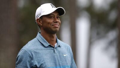 Tiger Woods grins on Monday during a practice round at Augusta National ahead of the Masters starting on Thursday. Andrew Gombert / EPA / April 6, 2015