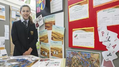 Kennedy Bullington, a 14-year-old pupil at Cranleigh Abu Dhabi, designed the board game Go! Abu Dhabi to provide an engaging way to teach social studies lessons dealing with the emirate’s culture and history. Mona Al Marzooqi / The National
