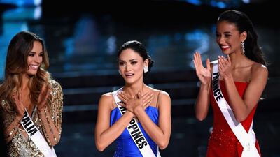 Miss Australia 2015, Monika Radulovic, Miss Philippines 2015, Pia Alonzo Wurtzbach, and Miss France 2015, Flora Coquerel, stand onstage. AFP