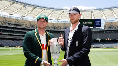 England captain Ben Stokes, right, and Australia skipper Steve Smith with the Ashes trophy replica at the Optus Stadium in Perth. PA