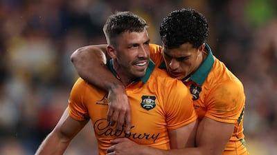 Australia's Jake Gordon celebrates scoring a try with Joseph-Aukuso Suaalii. Getty Images