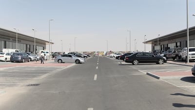 Car dealers at Abu Dhabi Motor World say sales have plunged to almost zero since they were forced to move to the new site on the outskirts of the city. Fatima Al Marzooqi / The National