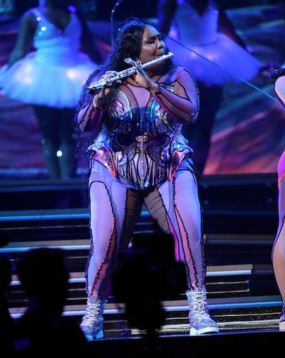 Lizzo plays the flute during her performance at the 62nd annual Grammy Awards. AP