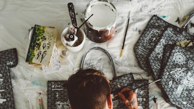 Artist Oliver Coreaux uses luxury handbags as a canvas for his paintings. Courtesy Oliver Coreaux