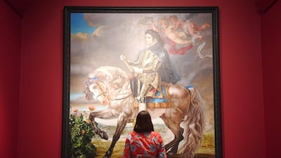 A woman poses near US painter Kehinde Wiley's "Equestrian Portrait of King Philip II (Michael Jackson)" during a press preview of the exhibition "Michael Jackson: On the Wall" at the National Portrait Gallery in London, Britain, on June 27, 2018.Neil Halll / EPA