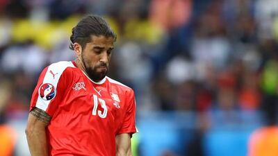 Andrei Prepelita of Romania goes down to a challenge from Ricardo Rodriguez of Switzerland during the UEFA EURO 2016 Group A match between Romania and Switzerland at Parc des Princes on June 15, 2016 in Paris, France. (Photo by Clive Mason/Getty Images)