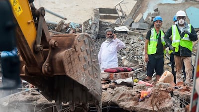 Rescue workers search for survivors in the rubble of a collapsed five-storey apartment building in Mahad, about 170 kilometres from India's financial capital of Mumbai. AFP
