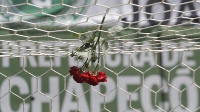 Flowers hang from a goal net at the Arena Conda stadium in Chapeco, Brazil, the home of the Chapecoense club. Andre Penner / AP Photo