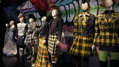 Dresses of the “Punk Cancan” collection are displayed during the exhibition devoted to French fashion designer Jean Paul Gaultier on March 30, 2015 in Paris. Patrick Kovarik / AFP photo