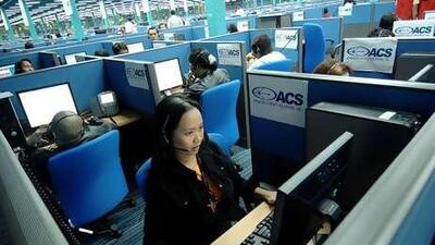 Call centre agents in the Philippines attend to US clients at a new branch of Advance Contact Solutions in Quezon city.