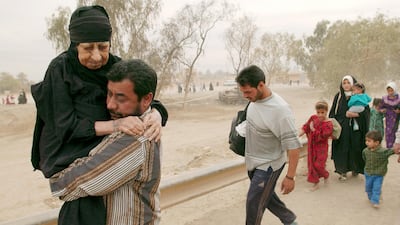 Iraqis fleeing during the fighting between US and Iraqi forces in 2003. AFP