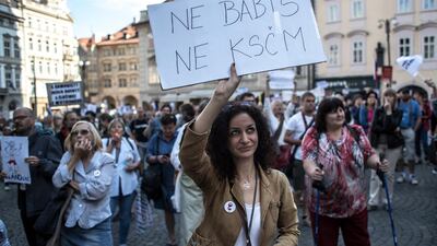 A woman holds a placard 'No Babis, No KSCM' as she protests against Andrej Babis' government supported by Communists during the confidence vote of his government. EPA/MARTIN DIVISEK
