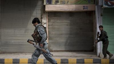 Afghan police men take position.