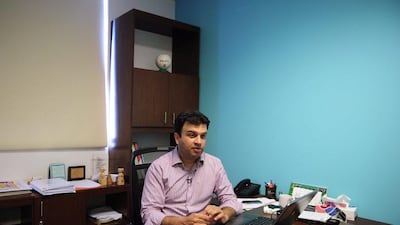 Khowaja Obaid, the head of AmanSports - the organisation running the camp for the Real Madrid Foundation - sits at his office in Karachi, Pakistan. Asif Hassan / AFP