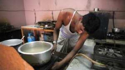 An Indian cook at a camp in Mussafah where labourers have had to rely on food handouts.