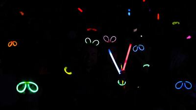 Iranians wearing glow stick glasses attend a concert of Iranian singer Mohammad Alizadeh (unseen) during the 32rd Fajr International Music Festival at the Milad Tower hall in Tehran, Iran. Abedin Taherkenreh / EPA