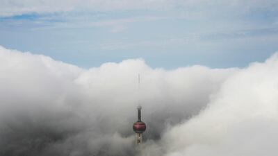 Skyscraper Oriental Pearl Tower is seen from the Shanghai World Financial Center on a hazy day in the financial district of Pudong in Shanghai, China. Aly Song / Reuters