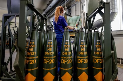 A Rheinmetall technician helps make ammunition that will be delivered to Ukrainian forces, at its factory in Unterluess, northern Germany. AFP