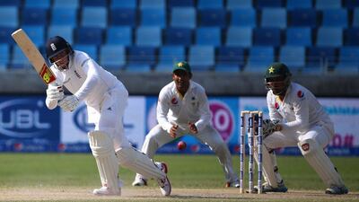 Joe Root, left, reached his half-century on Day 4 and will be key to England's hopes of saving a draw. Marwan Naamani / AFP