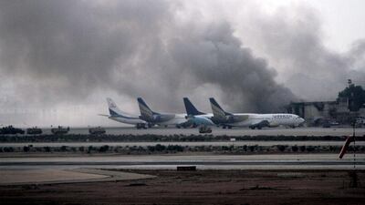 Smoke billows from inside the Jinnah International Airport, after suspected Islamic militants attacked the airport, in Karachi, Pakistan. At least 23 people, including 10 suspected terrorists, were killed when militants stormed the airport. EPA/REHAN KHAN