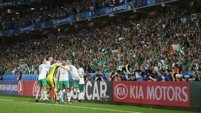 Republic of Ireland's Shane Long and Seamus Coleman celebrate with fans and teammates at the end of their match against Italy at Stade Pierre-Mauroy on June 22, 2016 in Lille, France. REUTERS/Carl Recine
