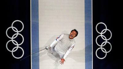 South Korea's Choi Byungchul celebrates defeating Italy's Andrea Baldini during their men's individual foil bronze medal fencing match at the ExCel. Fabrizio Bensch/Reuters