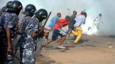 Togolese police spray tear gas at hundreds of supporters of Jean-Pierre Fabre, the leader of the Union of Forces of Change, the main party of the divided opposition, on March 7 in Lome, the country's capital, after an announcement of the election results.
